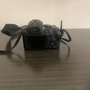 Panasonic Black Digital Camera with Zoom Lens and Viewfinder